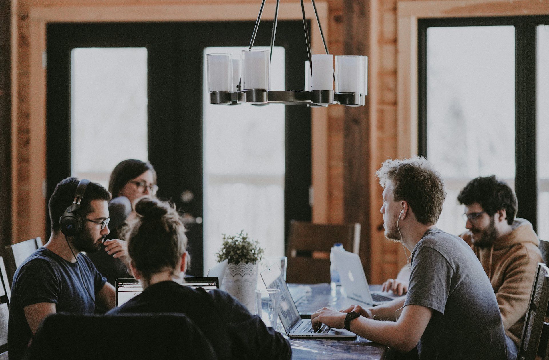 A professional team in discussion around a meeting table