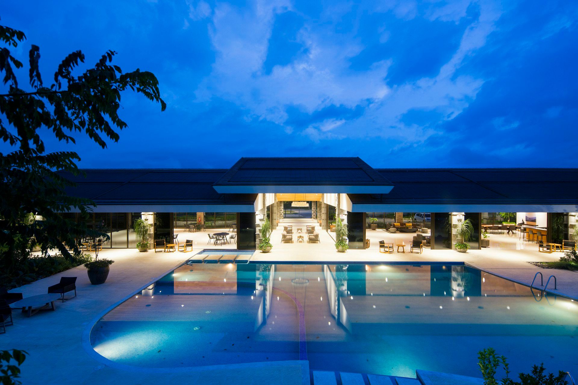 An elegant resort illuminated at night — representative of the upcoming Raipur hotel